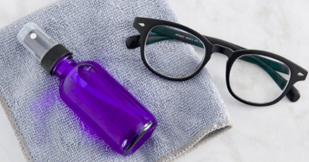black eyeglasses and cleaning fluid black eyeglasses and cleaning fluid